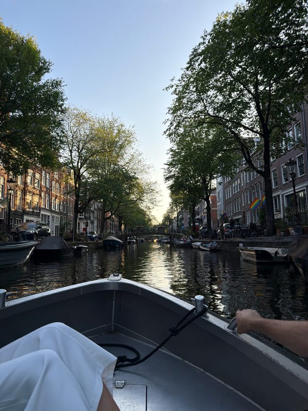 Evening canal cruise through Amsterdam's brick-lined waterways