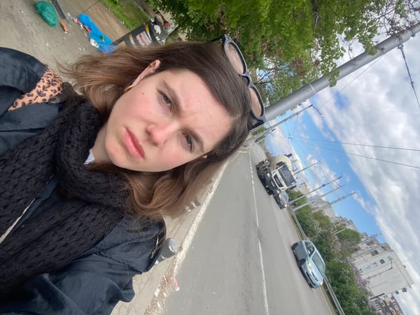 Woman takes sidewalk selfie in Sofia, Bulgaria