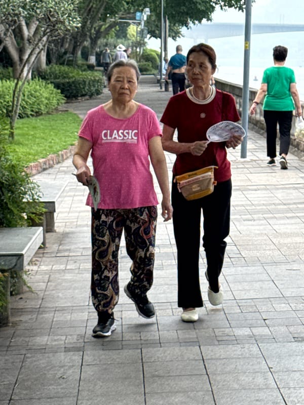 Residents enjoy routine activities along Jiangjin riverside promenade