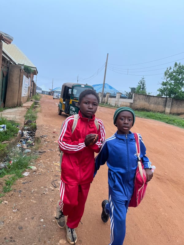 Morning street life in a Jos, Nigeria neighborhood