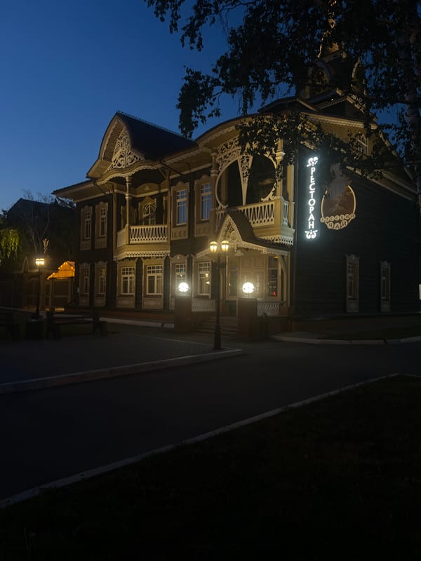 Barnaul's park district and wooden architecture at dusk