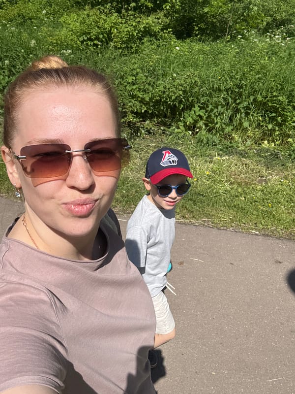 Mother and child enjoy sunny morning in Rusanovo park