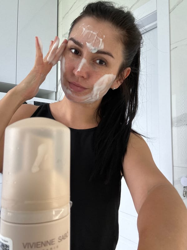 Woman documents morning skincare routine with flowers in Russia