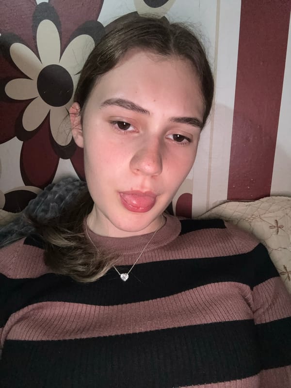 Woman makes playful expression in indoor photo, Panagyurishte