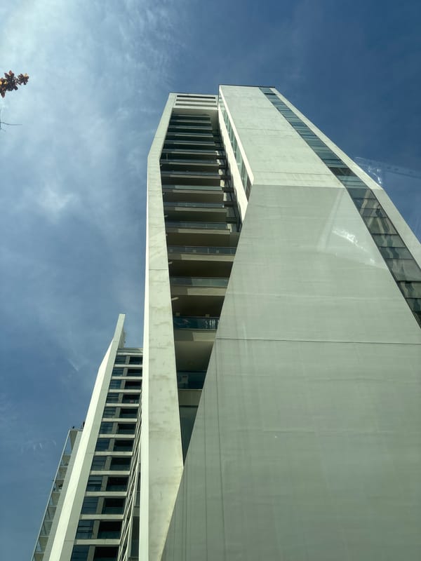 Modern angular white building photographed against blue sky