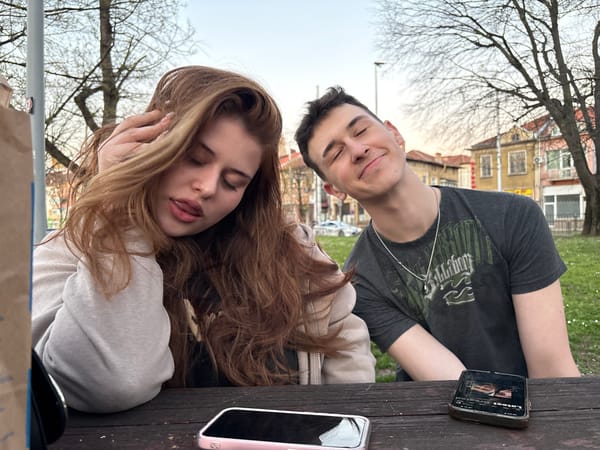 Young couple shares playful moments at Pleven park picnic