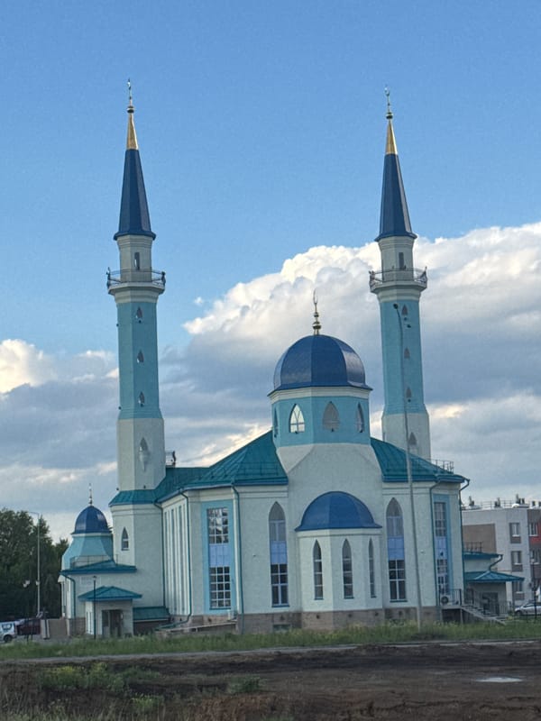 Mosque with blue domes, gold-topped minarets photographed in Ulyanovsk