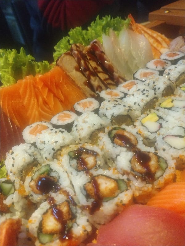 Family enjoys elaborate Japanese meal with sushi boats in Luxembourg