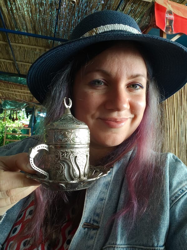 Woman enjoys Turkish coffee at Finike cafe Tuesday morning