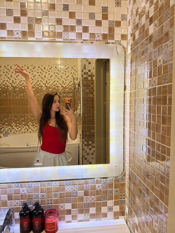 Bathroom mirror selfie session in Ufa, with a ballet outlier