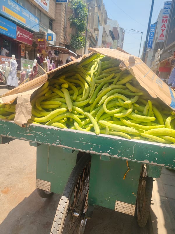 Street vendors sell produce from green cart in Bengaluru