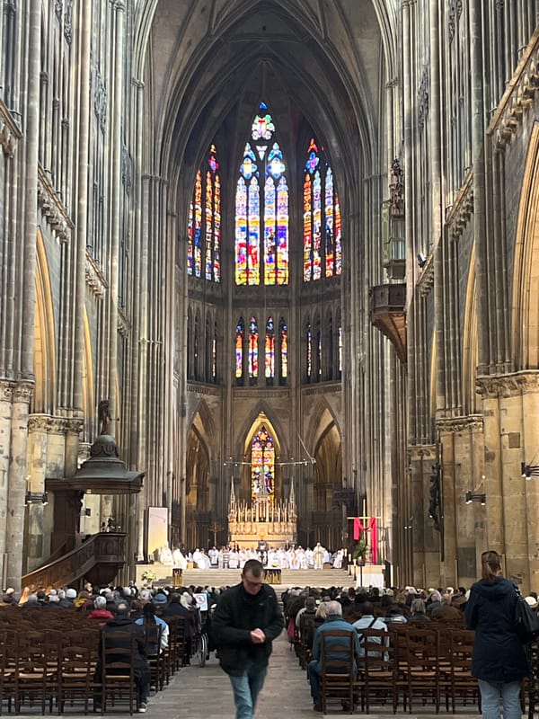 Tourists document Metz Cathedral and street art scenes