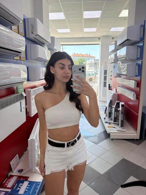 Mirror selfie in a Gabrovo appliance store, summer 2026