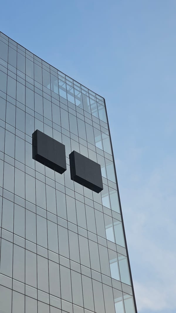 Dramatic sunset illuminates modern buildings and murals in Puebla