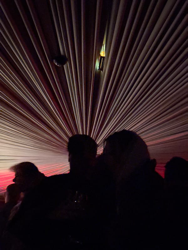 Red-lit music venue performance draws crowds in Paris