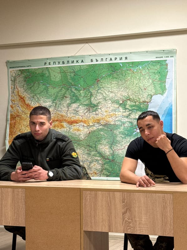 Two men photograph themselves with Bulgaria map display