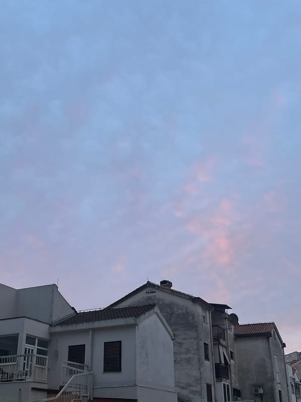 Aircraft with landing gear spotted over Budva during overcast evening