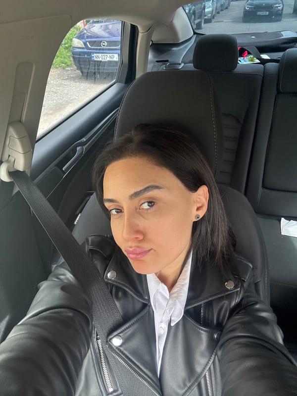 Woman photographed in car interior in Tbilisi