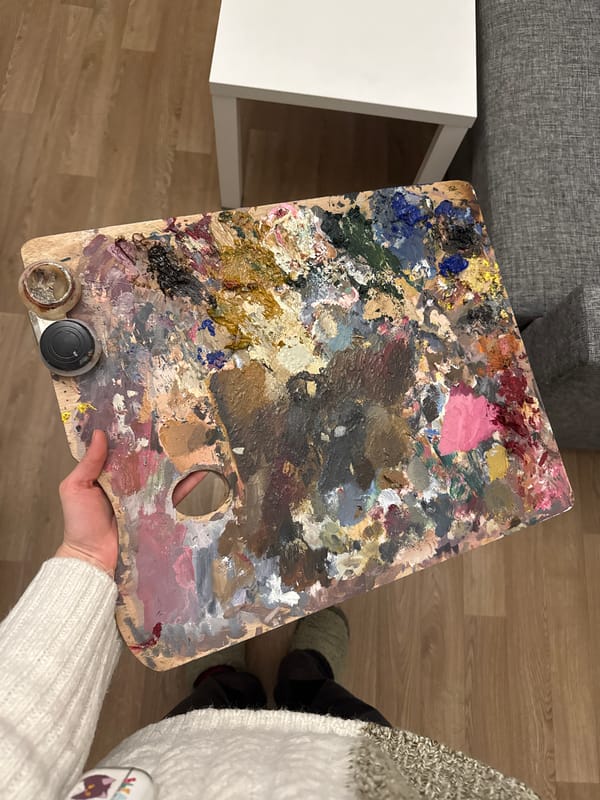 Artist's paint-laden wooden palette photographed in Moscow