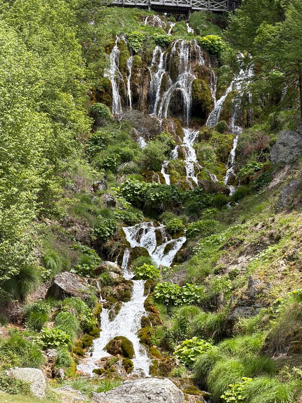 Rural waterfall and tractor scenes documented in Serbian countryside