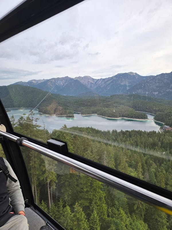 Cable car passenger photographs Eibsee Alpine landscape in Grainau