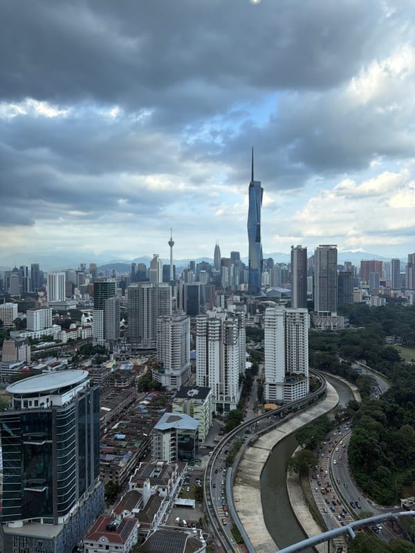 Tourists enjoy infinity pool with Kuala Lumpur city views