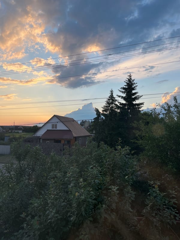 Rural home and yard at dusk, inside and out