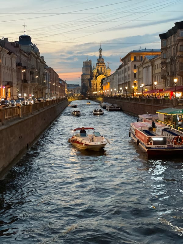 Dusk along Saint Petersburg's canals, Singer House, and carriage streets