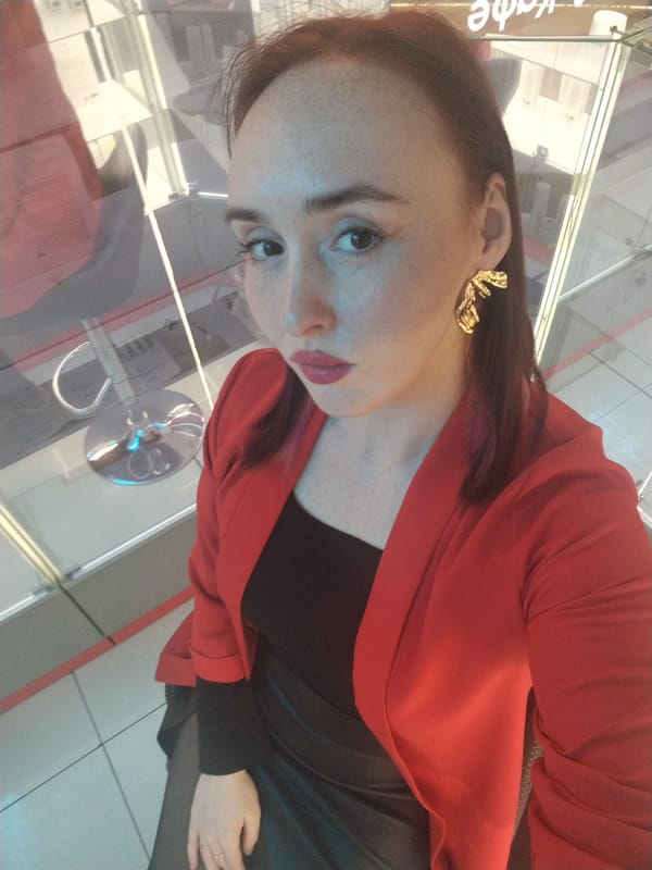 Woman takes selfie at Golden Tabakierka shop in Izhevsk