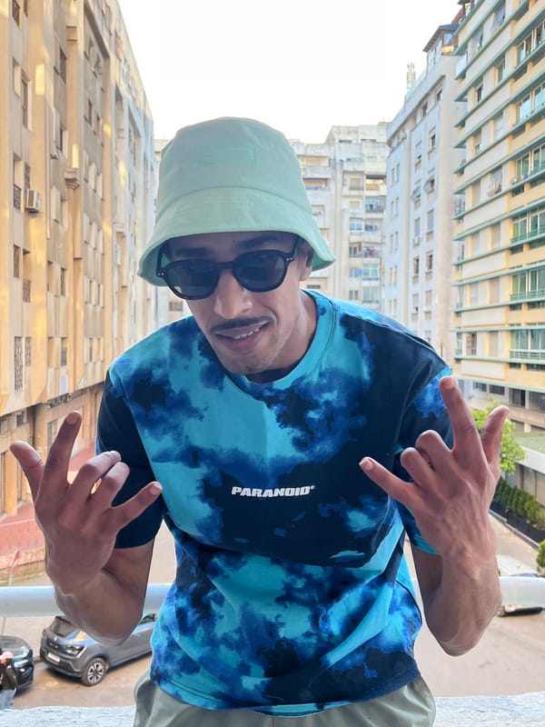 Woman walks dog in sunny Tangier public square