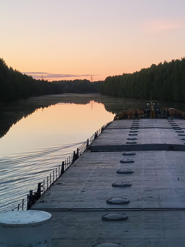 Peaceful sunrise captured from vessel deck near Devyatiny, Russia