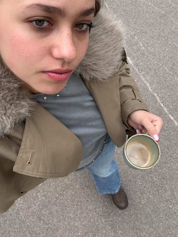 Morning selfie captured in Vienna with coffee mug