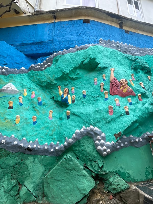 Buddhist ceremony observed in Dharamshala amid religious artwork