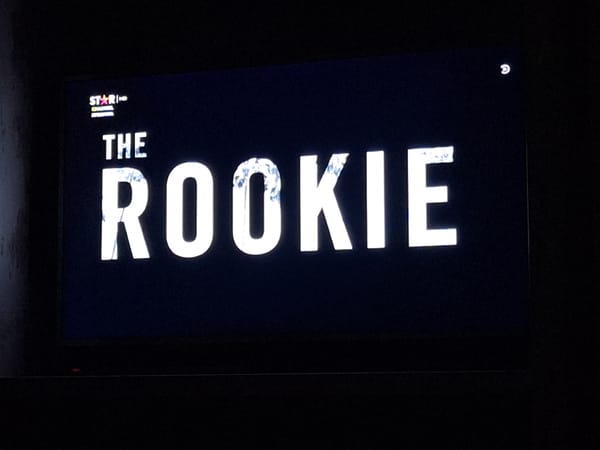 Television displays "The Rookie" show title card