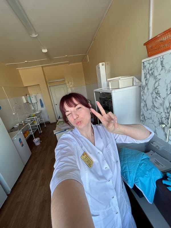 Healthcare worker takes selfie at medical clinic in Russia