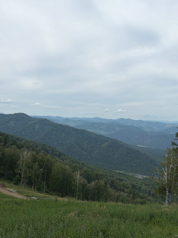 Summer activity at an Altai mountain resort, paragliding and trails