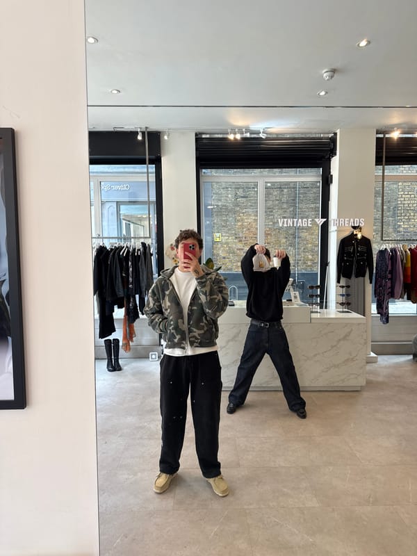Two shoppers spotted in London vintage clothing store mirror