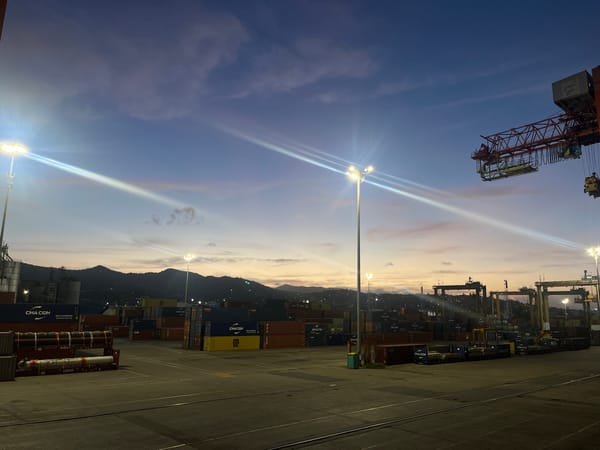 Twilight port operations documented by witnesses at coastal facility