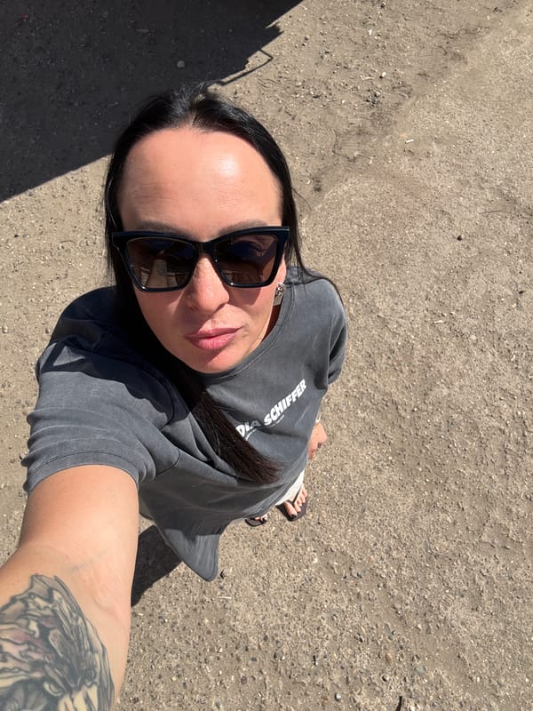 Woman takes selfie on dirt surface in Chaikovsky, Russia