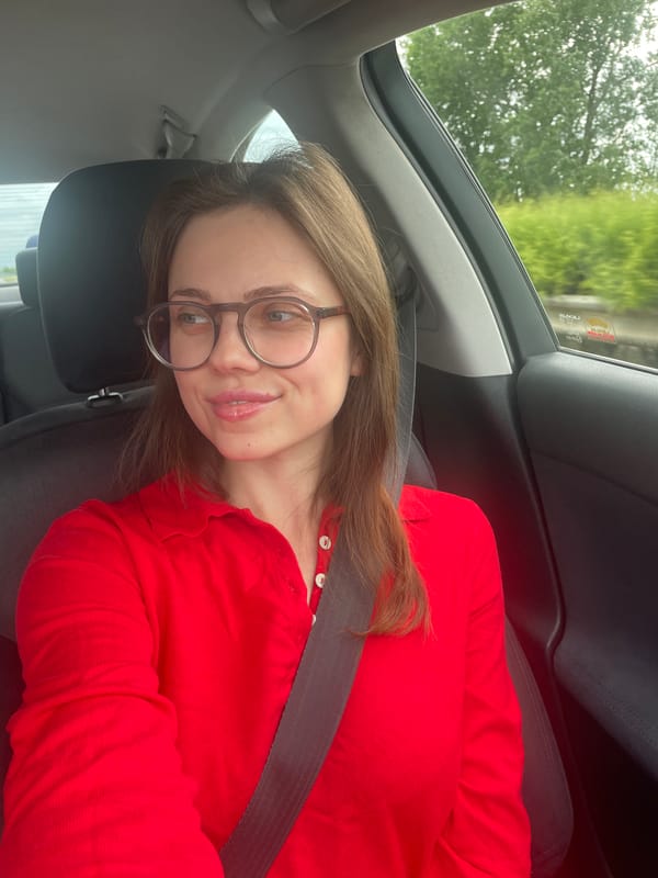 Woman in red shirt travels through Hungarian countryside
