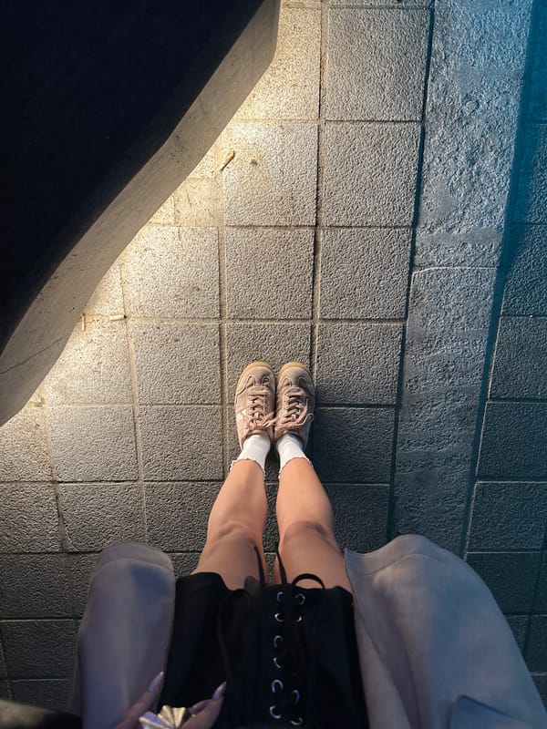 Person in sneakers spotted standing on pavement in South Korea