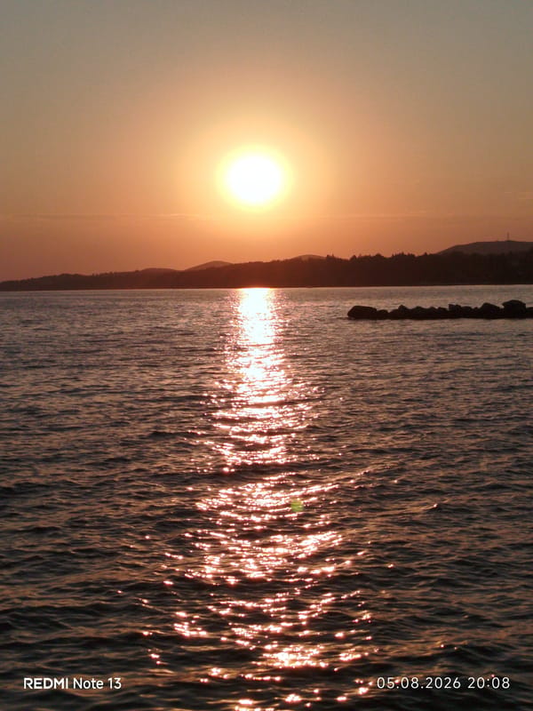 Sunset evening on a Sithonian beach, fishing and swimming.