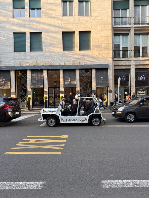 Branded vehicles spotted on Milan street during afternoon