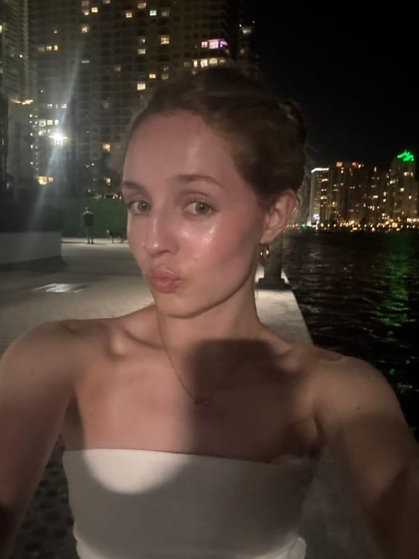 Late-night selfies with the Miami skyline glowing across Biscayne Bay