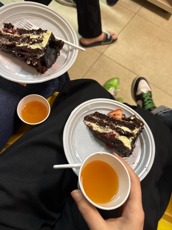 Two people share dessert moment indoors in Yerevan