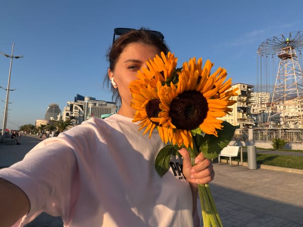 Sunflower bouquet photoshoot along Batumi's waterfront promenade