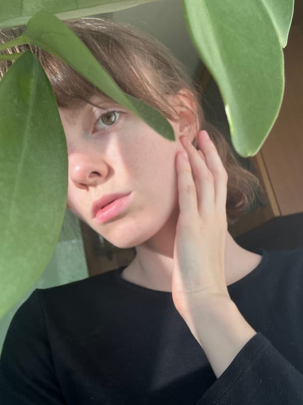 Contemplative moment captured among spring foliage in Moscow