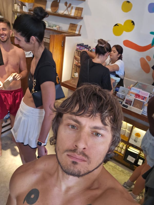 Tourist takes selfie in Tibubeneng shop