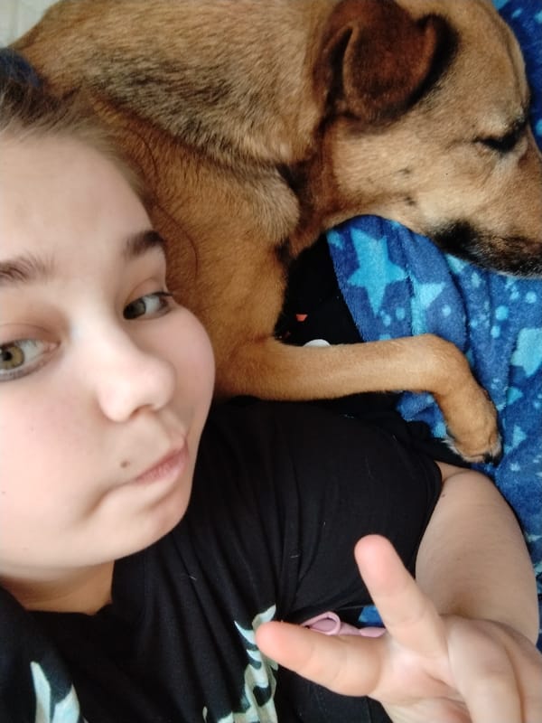 Person Takes Selfie with Dog in Plovdiv Home