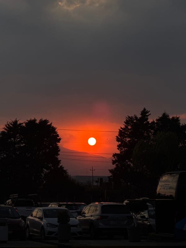 Hazy sunset documented through clouds in Huejotzingo, Mexico